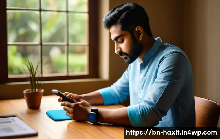 디지털 vs 아날로그 습관 추적 시스템 - A modern Bengali person sitting at a wooden desk in a cozy room, using a sleek smartphone and a fitn...